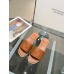 Christian Louboutin CL Mules in Brown Leather