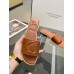 Christian Louboutin CL Mules in Brown Leather