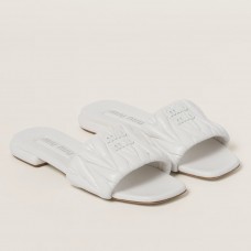 Miu Miu Women's Slides in White Matelasse Nappa Leather Miu Miu Women's Slides in White Matelasse Nappa Leather
