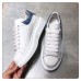 Alexander McQueen Women's Oversized Sneakers With Blue Suede Heel Alexander McQueen Women's Oversized Sneakers With Blue Suede Heel