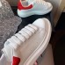 Alexander McQueen Women's Oversized Sneakers With Red Suede Heel Alexander McQueen Women's Oversized Sneakers With Red Suede Heel